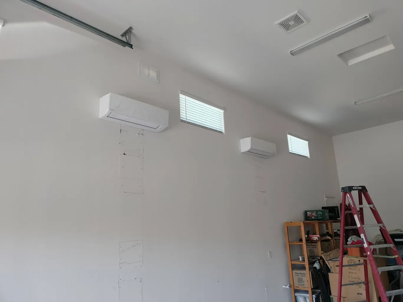 Two ductless mini-split air handlers installed in a Phoenix garage conversion