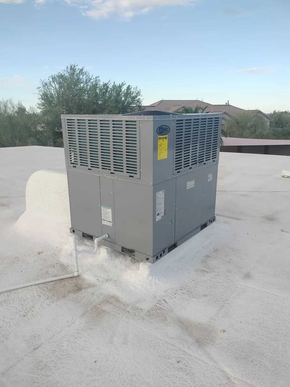 Trane rooftop packaged unit on a coated flat roof with a sealed curb in Phoenix