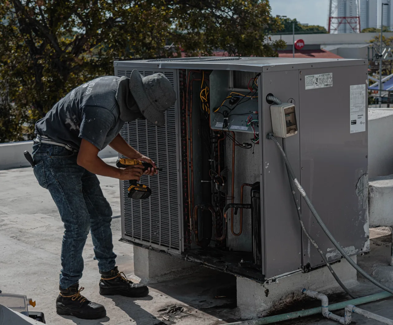 Desert Cool Mechanical technician servicing an AC condenser in the Phoenix metro